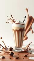 Delicious chocolate milkshake splashing in a glass with whipped cream and chocolate pieces photo