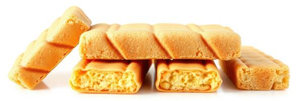 Delicious crunchy orange wafer bars stacked beautifully on a white background perfect for snack time photo