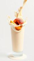 Creamy beverage splashing from a glass with fruit slice at a well-lit setting photo