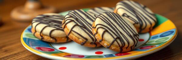 Delicious shortbread cookies drizzled with chocolate served on a colorful plate photo