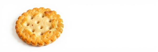 Crunchy round biscuit on a clean white surface ready for a snack or pairing with cheese photo