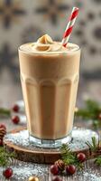 Creamy milkshake on a wooden table topped with whipped cream and a festive straw in a cozy setting during winter photo