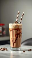 Delicious chocolate milkshake served in a tall glass with striped straws on a marble countertop photo