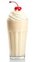 Creamy milkshake topped with whipped cream and cherry served in a tall glass photo