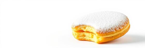Sweet pastry topped with powdered sugar sits on a white surface, showcasing its delicate layers and inviting texture photo