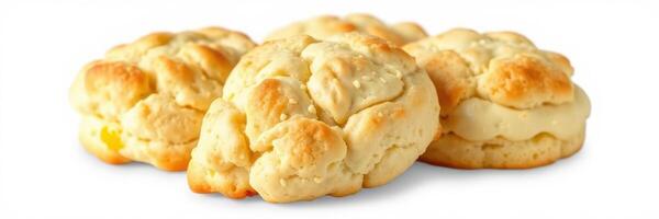 Freshly baked fluffy biscuits on a white background showcasing delicious texture and golden tops photo