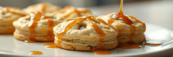 Delicious dessert featuring cookies drizzled with caramel sauce on a white plate photo