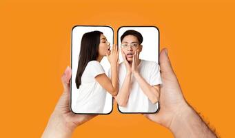 A couple is seen engaging with each other through their smartphones. Each is using a messaging app to communicate while displaying excitement. photo