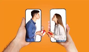 A young couple expresses their affection through a virtual exchange on their smartphones. Each holds a gift while sharing playful kisses, showcasing modern romance and connection. photo