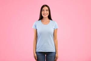 Portrait of beautiful casual woman smiling, looking and posing at camera isolated over yellow studio background. Confident caucasian lady with happy facial expression showing positive emotions photo