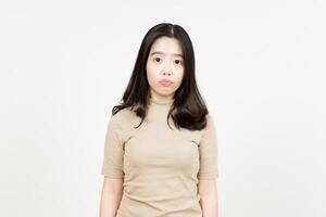 Looking to Camera with Expressionless Face Of Beautiful Asian Woman Isolated On White Background photo