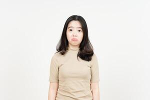 Looking to camera with sad face expression Of Beautiful Asian Woman Isolated On White Background photo
