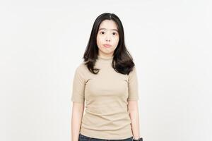 Looking to Camera with Expressionless Face Of Beautiful Asian Woman Isolated On White Background photo