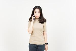 Talking on smartphone and get angry Of Beautiful Asian Woman Isolated On White Background photo