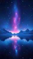A stunning display of stars and galactic colors reflects on a calm lake beneath snow-capped mountains photo
