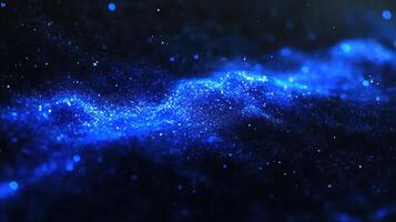Sparkling blue cosmic dust forms a mesmerizing pattern in the vast darkness of space photo