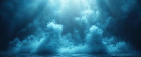 Soft blue clouds spread across the sky, illuminating the calm water below in the quiet of dawn photo