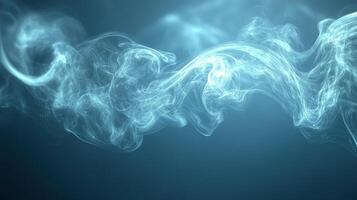 Wisps of soft blue smoke curl and flow gently, creating a serene atmosphere in a dark space photo