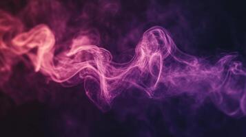 Flowing smoke in vivid pink and purple hues dances against the darkness, creating an enchanting visual effect photo