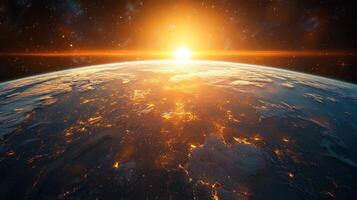 The sun rises over Earth, casting a warm glow across the planet's surface while stars twinkle in the dark expanse photo