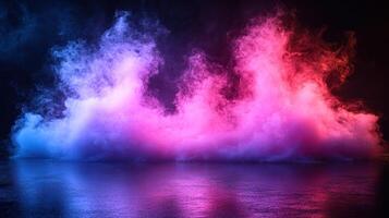 Vibrant blue and pink smoke billows across a reflective surface, creating an enchanting atmosphere in low light photo