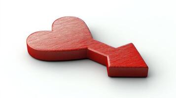 A red heart with an arrow design rests on a clean white surface, symbolizing love and passion photo