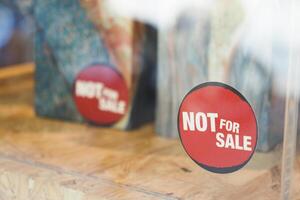 AttentionGrabbing Red Not For Sale Sign in an Art Gallery Display photo