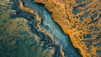Aerial View of a River Cutting Through a Field of Yellow Grass photo