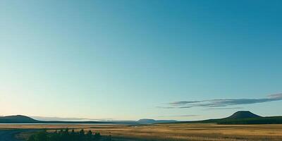 Serene landscape under a vast blue sky photo
