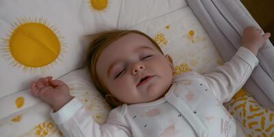 Infant sleeping soundly in crib photo