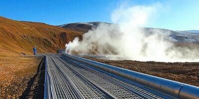 Steam coming out of a geyser in the middle of a field photo