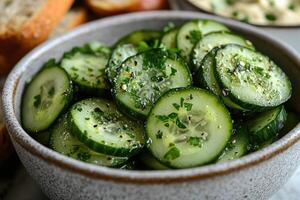 Refreshing cucumber salad with parsley and spices in a bowl photo