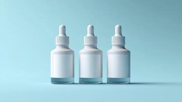 Three transparent dropper bottles with blank white labels on a pastel blue background photo