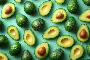 Fresh avocados whole and halved creating a vibrant green pattern photo