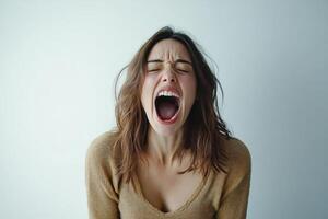 Emotional expression of a woman shouting in a minimalistic setting during indoor daylight photo