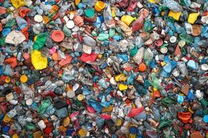 Plastic waste accumulation in a landfill shows various colors and types of discarded materials photo