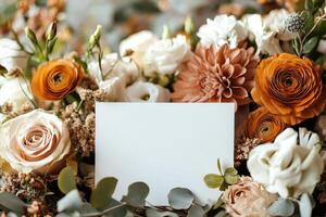 Beautiful arrangement of roses and seasonal flowers with blank card for personal messages photo