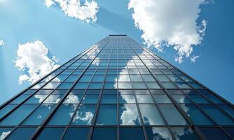 Modern glass skyscraper upward perspective reflective windows blue photo