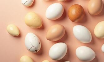 Assorted eggs Various colors and textures Peach background photo