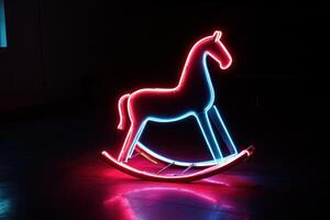A glowing neon rocking horse stands prominently in a dimly lit area, showcasing bright pink and blue lights. Its artistic design captures attention, creating a playful atmosphere. photo