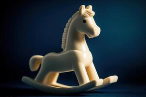 A carved, vintage rocking horse figurine sits on a curved base, illuminated by gentle light. The shape and texture highlight its nostalgic design, making it an appealing decorative piece. photo
