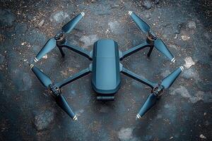 A sleek drone sits on uneven ground, poised for flight. Its propellers are ready to spin, suggesting a mission of capturing breathtaking aerial views in a natural setting. photo