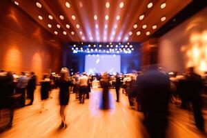 Guests fill a grand hall, moving rhythmically to music under dazzling lights during a sophisticated event. The atmosphere is festive, highlighting social interactions and celebration. photo