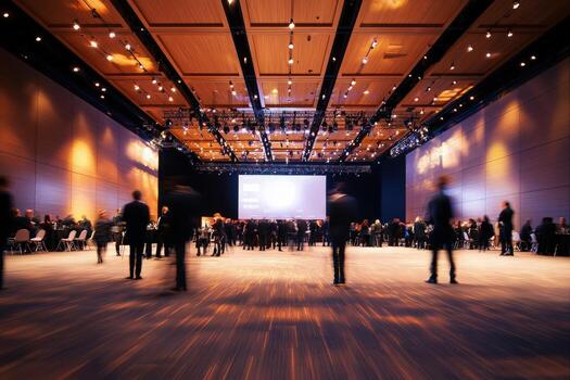 Professionals gather for a business conference in a spacious hall with dim lighting. Discussions and networking occur as attendees engage with each other in a collaborative atmosphere. photo