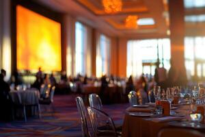 Tables are elegantly arranged for a formal dinner, bathed in warm orange light from large windows. Guests mingle and enjoy the atmosphere in a stylish space. photo