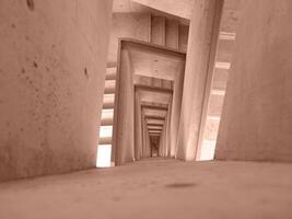 Top Down View of Stairs. Emergency Exit Concept. The winding stairs are empty. Abstract background. Mocha Mousse, Color of the Year 2025. photo