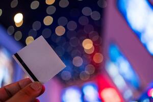 Man holding or showing a cinema ticket. photo