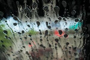 Soap sud wave pattern on car windshield photo