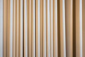 Cream colored cloth, beige curtain fabric texture and background. photo