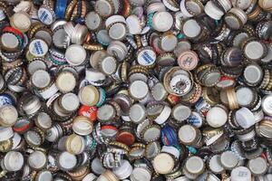 turkey istanbul 18 january 2024. Assorted bottle caps create a colorful background, ideal for beverage, beer, and soda designs photo